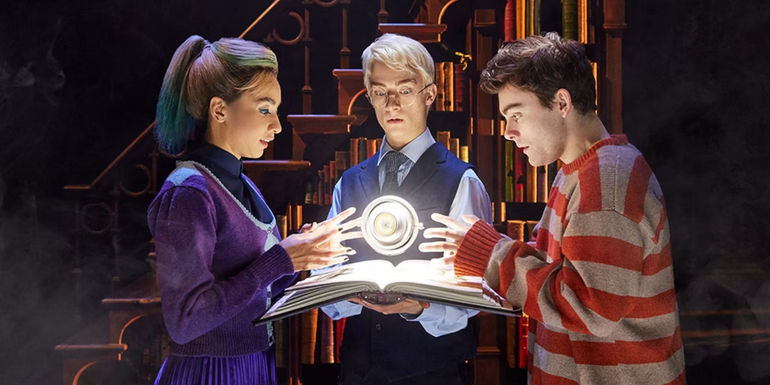 Albus, Scorpius, and Delphini looking at the time turner in Harry Potter and the Cursed Child