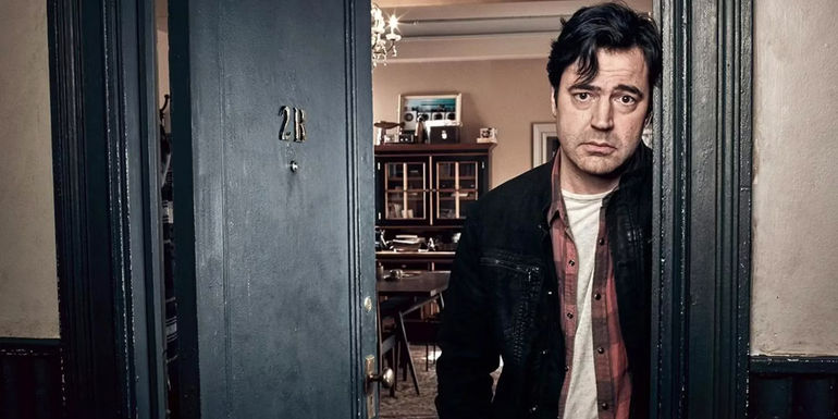 Ron Livingston in a doorway in Loudermilk