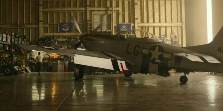 A P-51 Mustang plane in a hangar in Top Gun: Maverick
