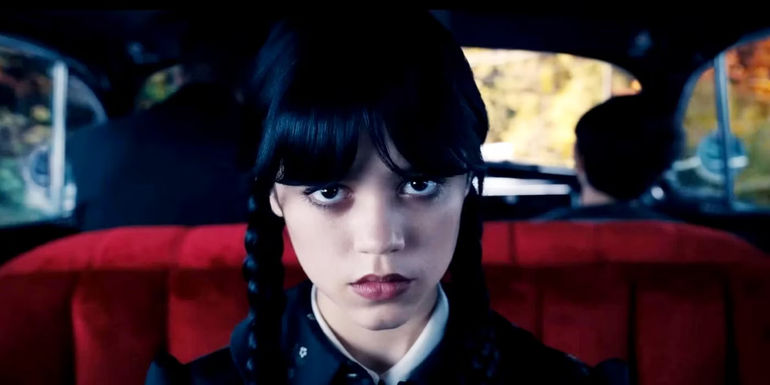 Jenna Ortega as Wednesday being driven by Lurch in Wednesday