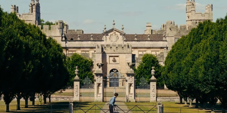 Oliver (Barry Keoghan) arriving at the Saltburn estate in Saltburn.