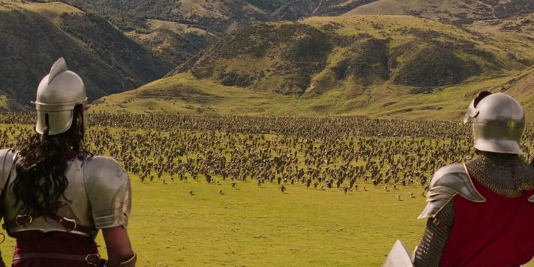 William Moseley as Peter Pevensie and Patrick Kake as General Oreius looking out over a battlefield in in The Chronicles of Narnia: The Lion, The Witch, and The Wardrobe