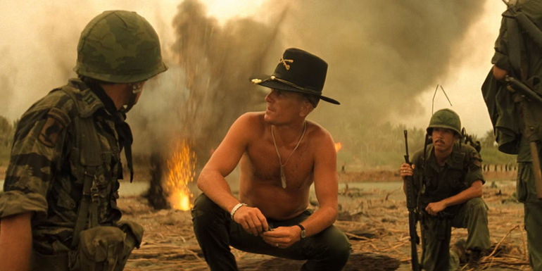 Kilgore kneeling on a battlefield in Apocalypse Now.