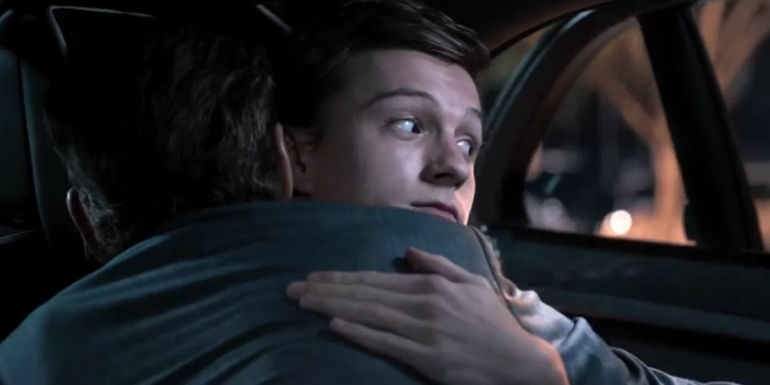 Tom Holland as Peter Park hugging Robert Downey Jr. as Tony Stark in Spider-Man: Homecoming