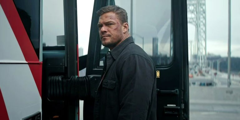 Alan Ritchson as Reacher looking back at Neagley while at the bus door in the Reacher season 2 finale