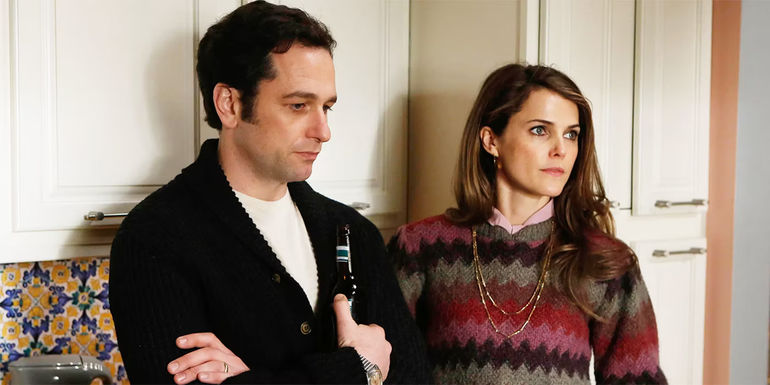 Keri Russell and Matthew Rhys standing in the kitchen in The Americans season 1
