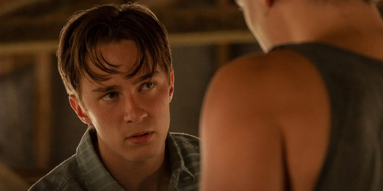 Drew Starkey as Rafe Cameron talking to another character in Outer Banks