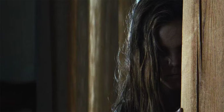 Pet Sematary 2019 resurrected Ellie creeping behind a door