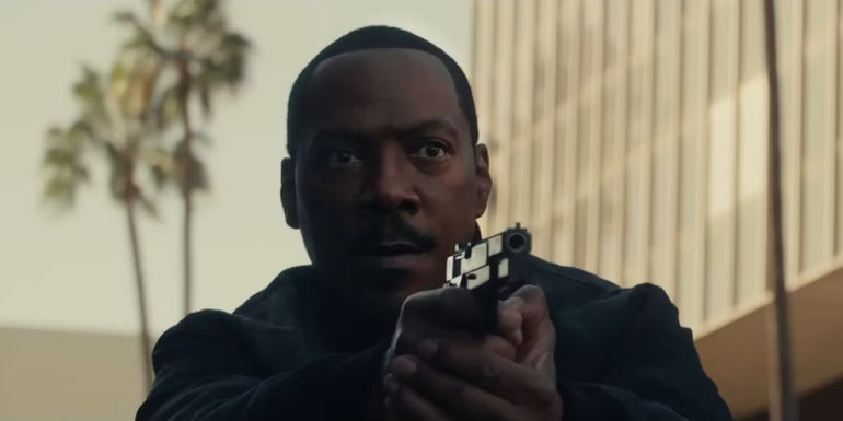 Eddie Murphy as Axel Foley holds his gun in Beverly Hills Cop: Axel F.