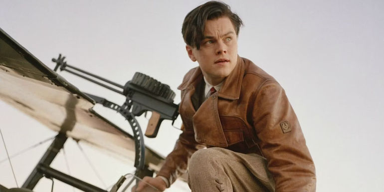 Howard Hughes (Leonardo DiCaprio) atop a plane in The Aviator.