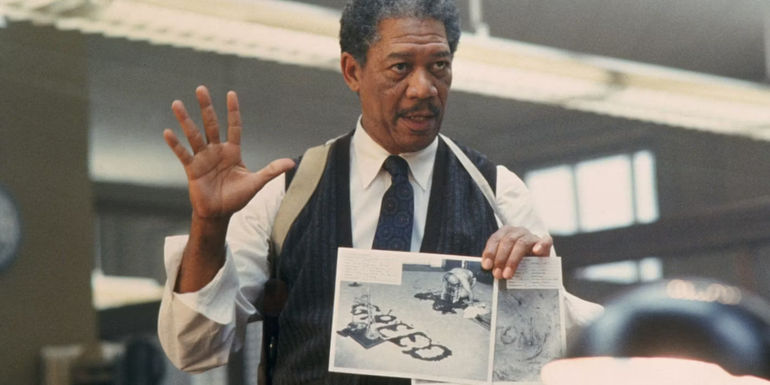 Sommerset holding up a crime scene photo in Se7en