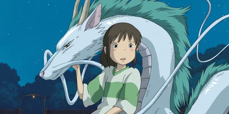Chihiro Ogino standing with Haku the dragon in Spirited Away