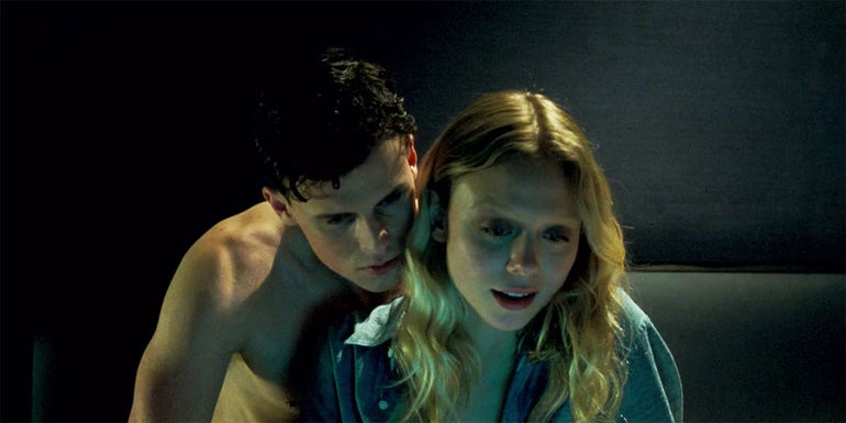 The Postcard Killings Simon and Marina Haysmith in a hotel room