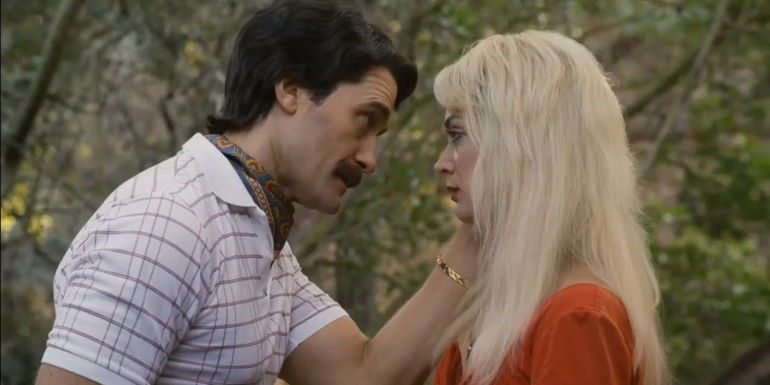 Trevor (Matthew Morrison) holding Montana's (Billie Lourd) cheek in his hand in AHS 1984.