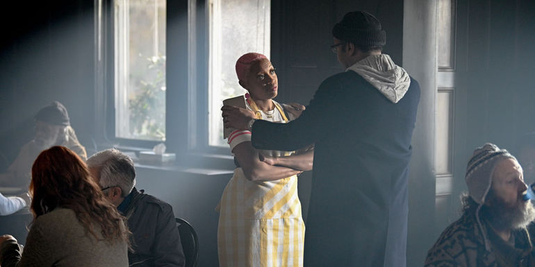 Travina Springer as Kylie looking at Alec in The Irrational 108.