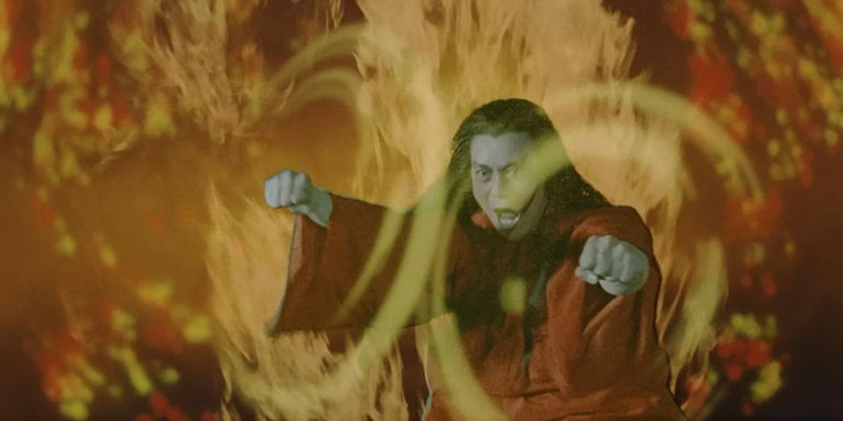 Norman Chui holding his fists out in anger