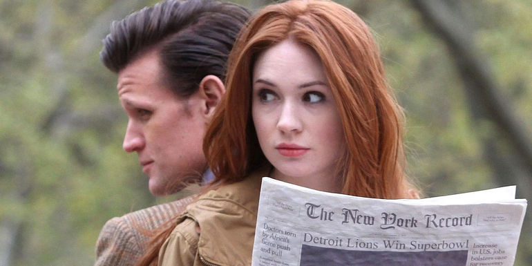 Matt Smith and Karen Gillan as The Eleventh Doctor and Amy Pond reading together in Doctor Who