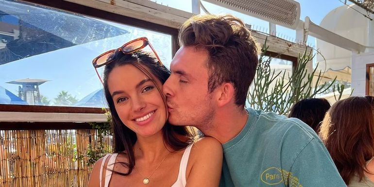 James Kennedy from Vanderpump Rules gives girlfriend Ally Lewber a kiss on the cheek.