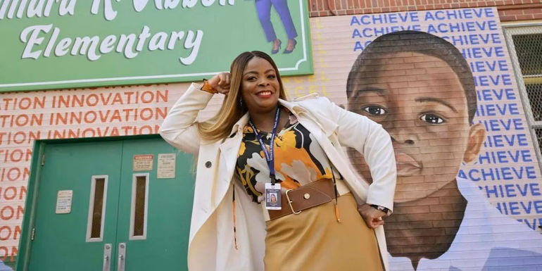 Principal Ava posing for the camera in Abbott Elementary