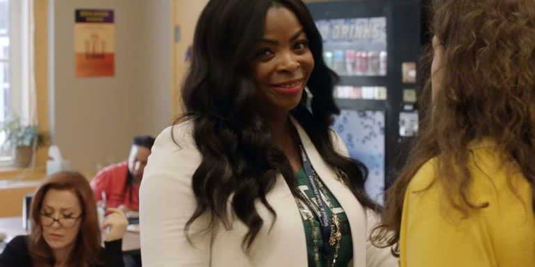 Principal Ava smiling while looking at the camera in Abbott Elementary