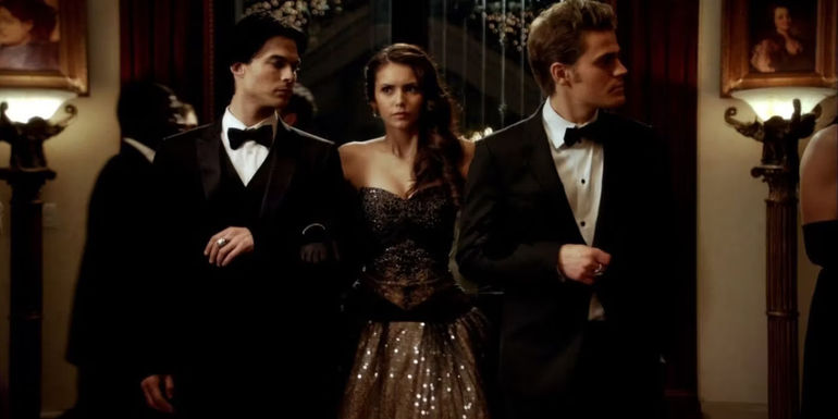 Damon, Elena, and Stefan walking together in formal wear in The Vampire Diaries
