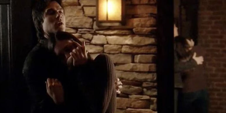 Elena drinking blood from Damons wrist in The Vampire Diaries episode Memorial