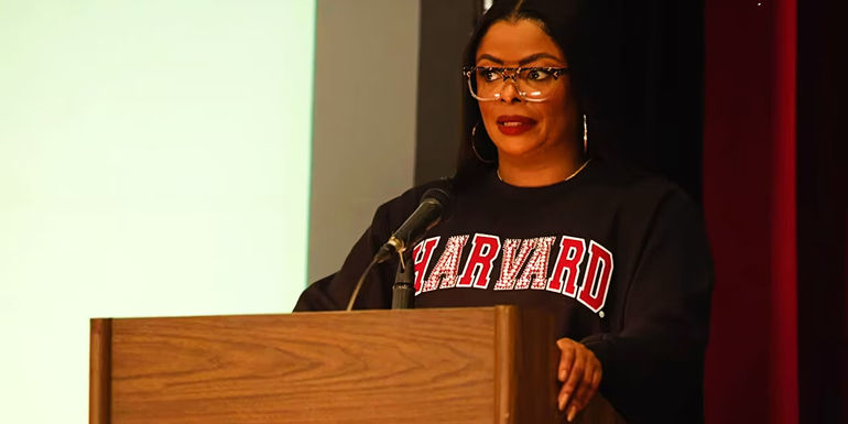 Janelle James as Ava standing at podium in Abbott Elementary season 3