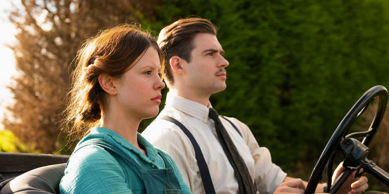 Pearl riding in a car with the Projectionist.