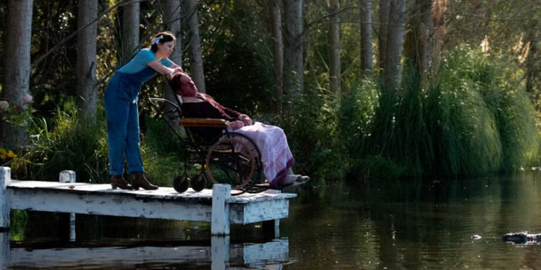 Pearl on the dock with her father in a wheelchair