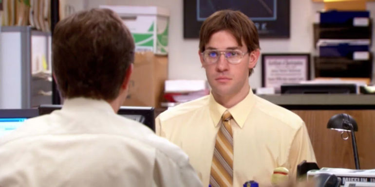 John Krasinski as Jim Halpert pretending to be Dwight in The Office