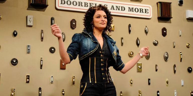 Jenny Slate on Saturday Night Live standing in front of doorbells