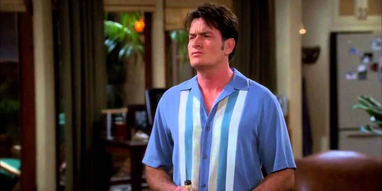 Charlie Harper standing in his living room