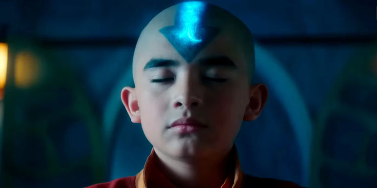Gordon Cormier as Aang Closing His Eyes with a Glowing Arrow Tattoo in the Live-Action Avatar: The Last Airbender.