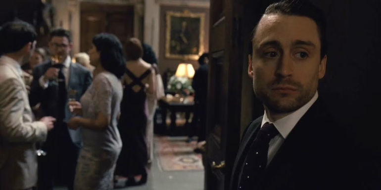 Roman standing outside the doors and looking worried in Succession season 1's finale