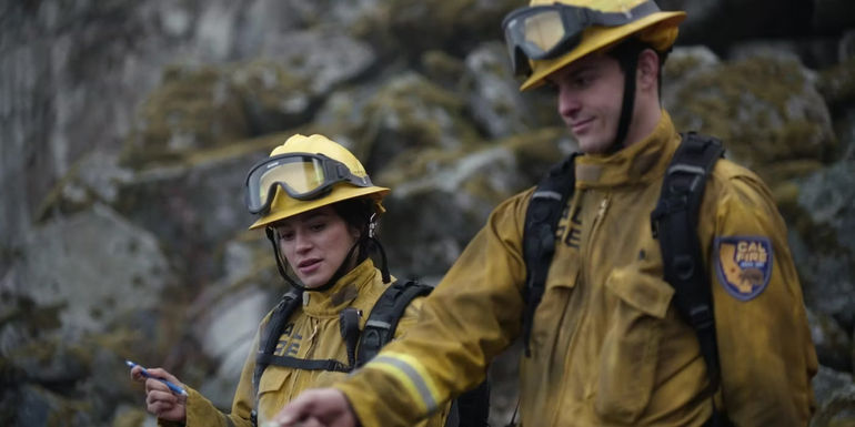 Gabriela Perez (Stephanie Arcila) and Alex Shawcross investigating a burn site in Fire Country.