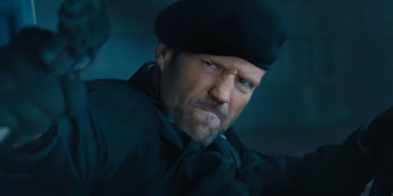 Jason Statham as Lee Christmas aiming a gun in Expendables 4.