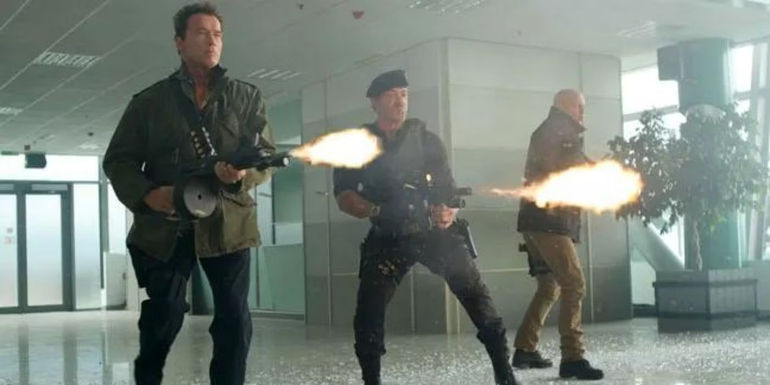 Arnold Schwarzenegger, Sylvester Stallone, and Bruce Willis as Trench Mauser, Barney Ross, and Mr. Church in The Expendables 2.