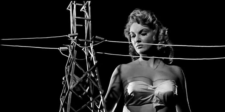 Nancy looks past power lines in Attack of the 50 ft Woman