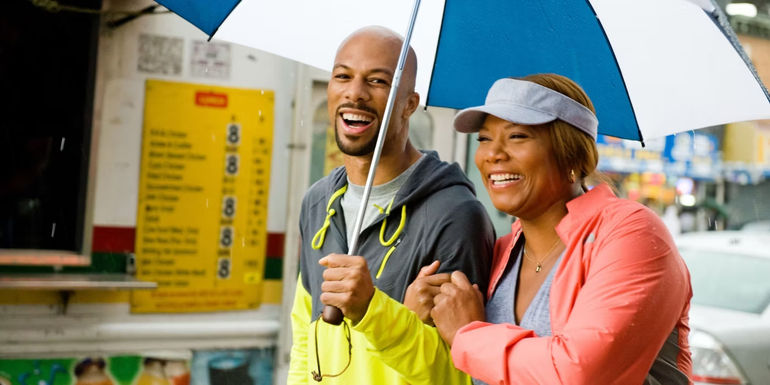 Common and Queen Latifah under an umbrella in Just Wright