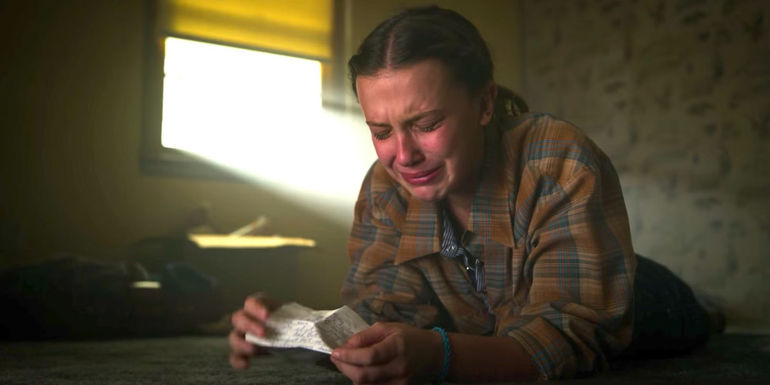 Eleven crying after reading Hopper's letter in Stranger Things season 3