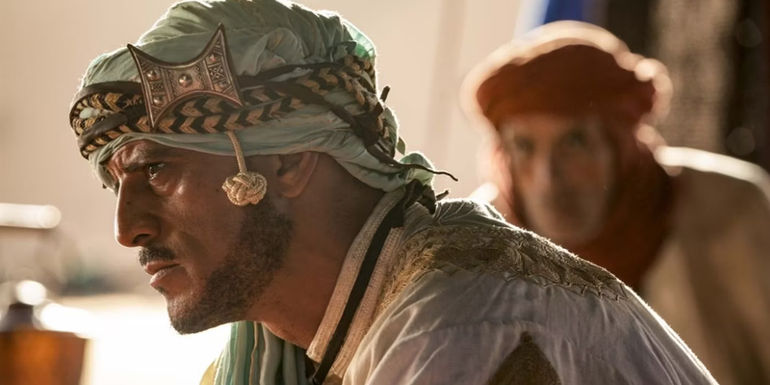 The elder leans forward toward John in John Wick: Chapter 3 - Parabellum