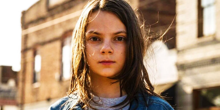Dafne Keen as Laura looking at the camera in Logan