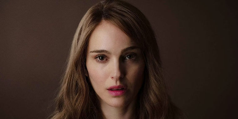 Elizabeth looks into the camera with her mouth slightly open in May December.