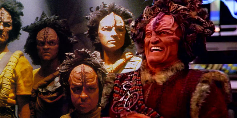 Maje Culluh (Anthony De Longis) laughing on the bridge of the USS Voyager with other Kazon from Star Trek: Voyager in the background.