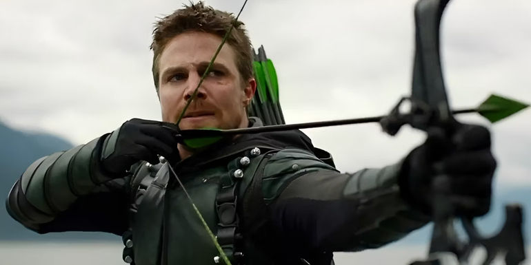 Oliver Queen unmasked with his arrow up in Arrow 