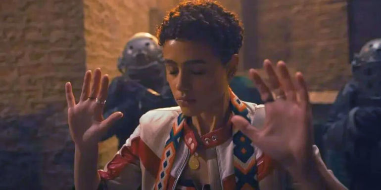 Ramsey with her hands up and eyes closed in Fast X