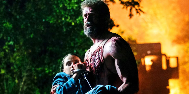 Wolverine carrying Laura in Logan