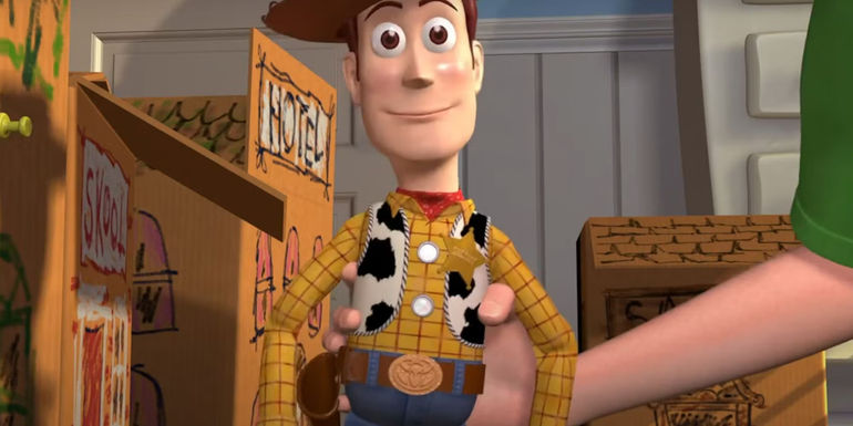 Woody being held up by Andy in Toy Story