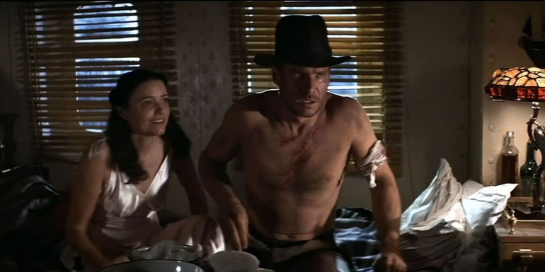 Indiana Jones and Marion Ravenwood on a boat together in Raiders of the Lost Ark