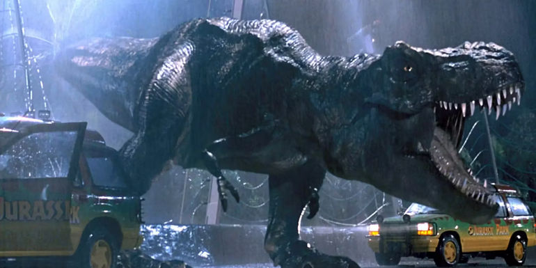 The T-Rex roaring in a downpour as she escapes from her enclosure in Jurassic Park.